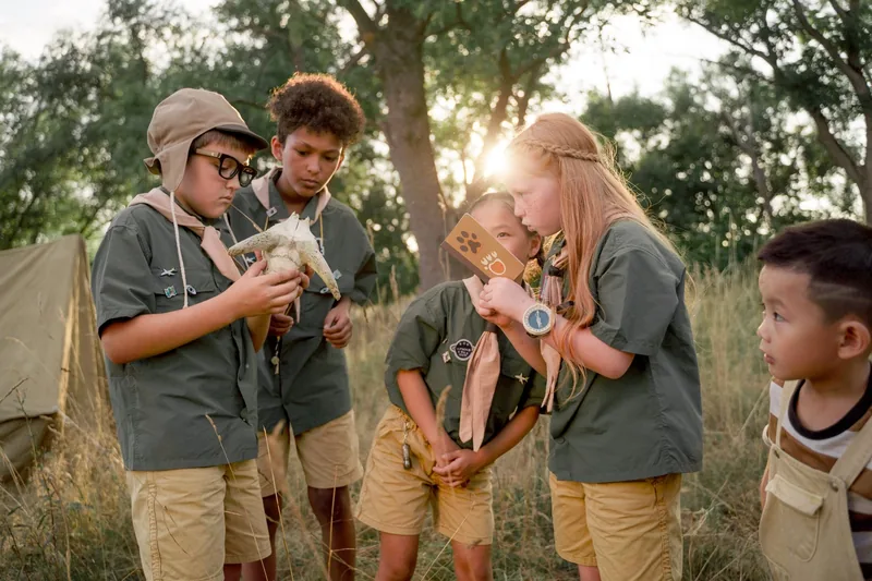 Kids in a group activity at summer camp following our summer camp guide tips
