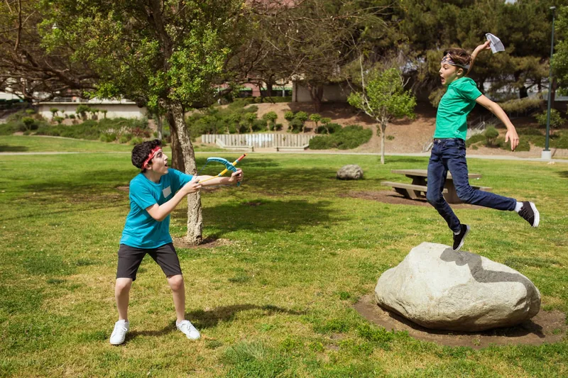 Children playing outdoor team games at a summer camp